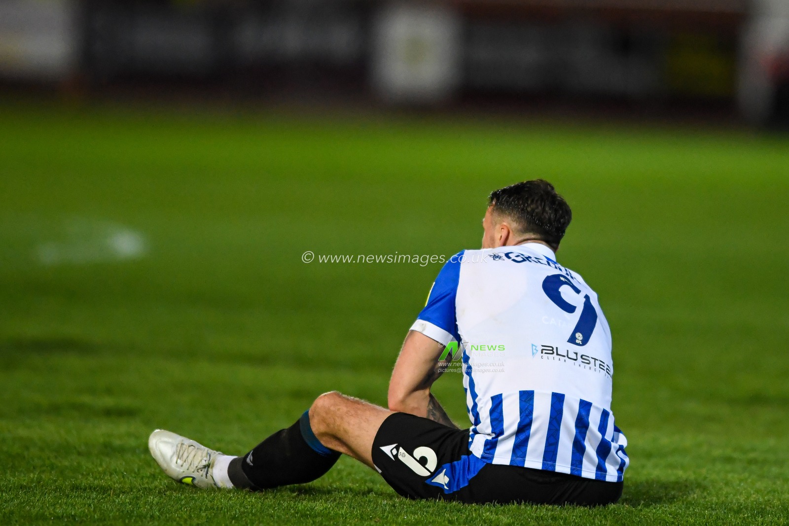 Lee Gregory #9 of Sheffield Wednesday sits on the pitch