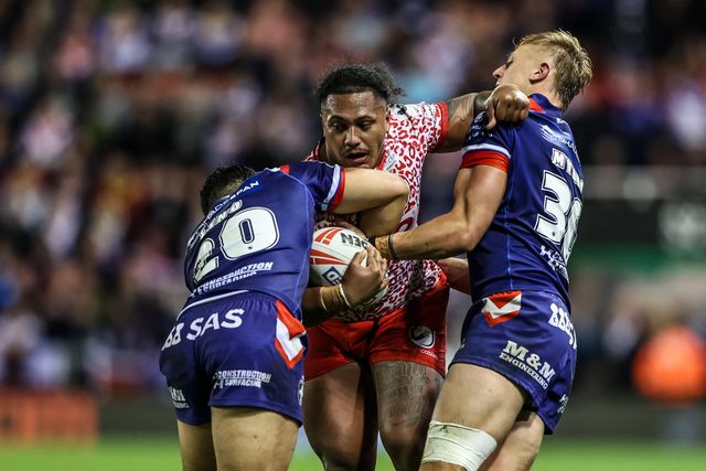 Tesi Niu of Leigh Leopards is tackled during the Betfred Super League play-off Eliminator 1 match Leigh Leopards vs Wakefield Trinity at Progress With Unity Stadium, Leigh, United Kingdom, 26th September 2025

(Photo by Alfie Cosgrove/News Images)