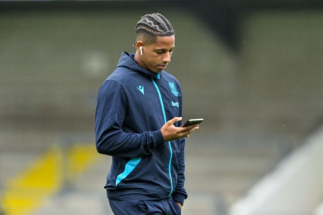AndrÃ© Vidigal of Stoke City checks his phone as he inspects the pitch ahead of the Pre-season friendly match Chester vs Stoke City at Deva Stadium, Chester, United Kingdom, 11th July 2024

(Photo by Cody Froggatt/News Images)