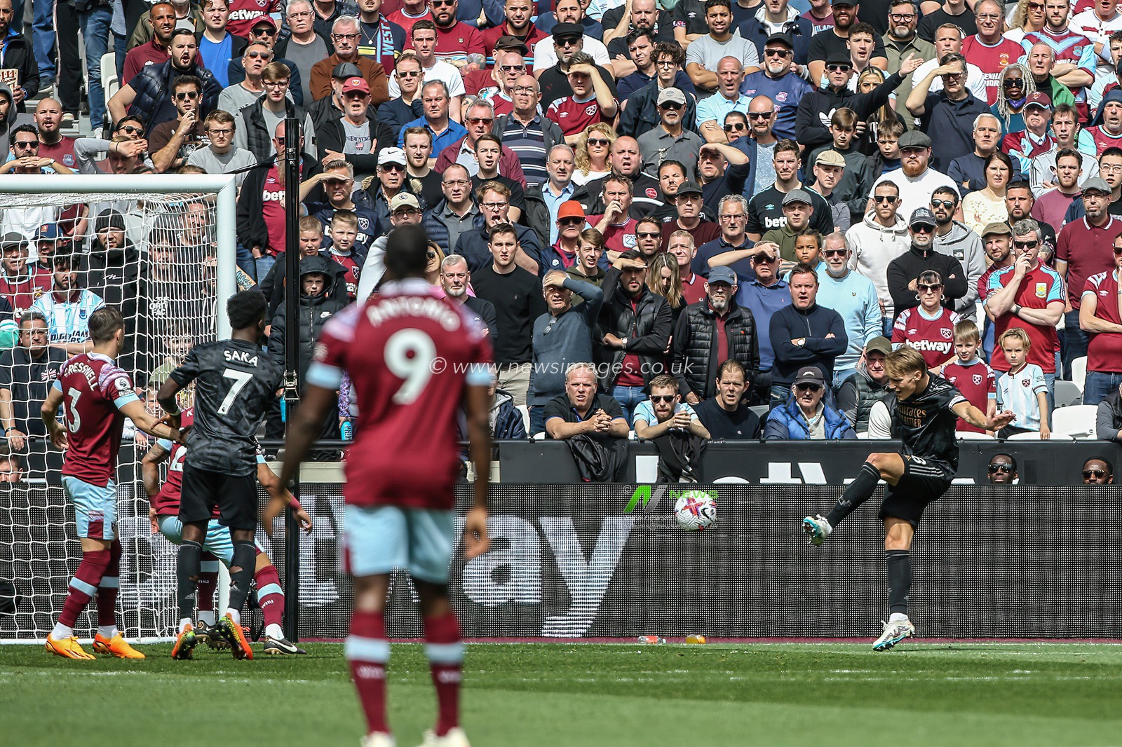 Martin Ã˜degaard #8 of Arsenal scores to make it 0-2 during the Premier League match West Ham United vs Arsenal at London Stadium, London, United Kingdom, 16th April 2023

(Photo by Arron Gent/News Images)