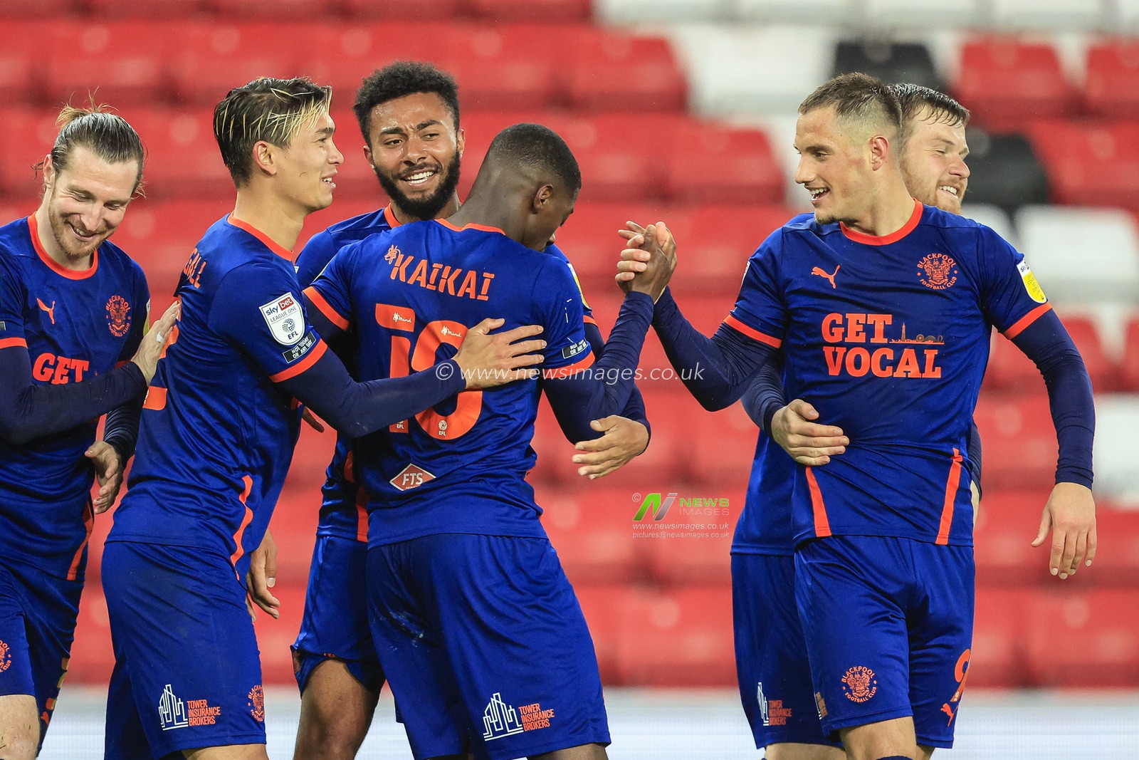 Sullay Kaikai #10 of Blackpool celebrates his goal with his teammates to make it 0-1