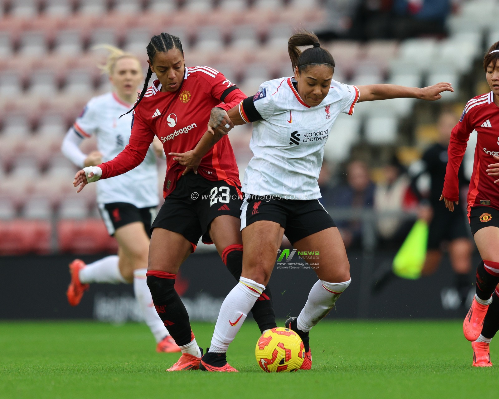 Taylor Hinds of Liverpool is tackled by Geyse of Manchester United during the Barclays Women's Super League match Manchester United Women vs Liverpool Women at Leigh Sports Village, Leigh, United Kingdom, 8th December 2024

(Photo by Alex Roebuck/News Images)