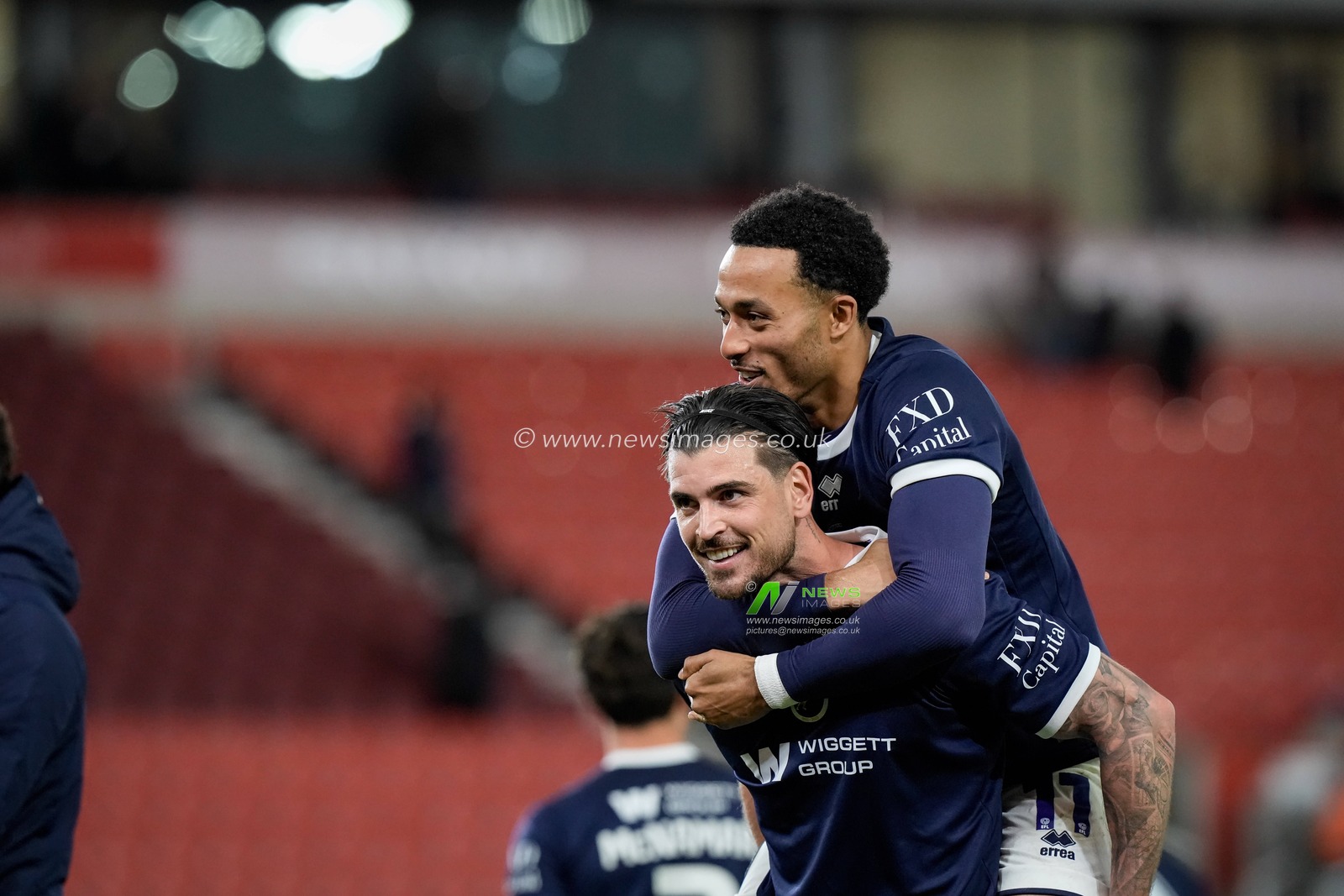 Tristan Crama of Millwall and Femi Azeez of Millwall  celebrates their team winning 1-3 and applaud the fans after the final whistle  during the Sky Bet Championship match Stoke City vs Millwall at Bet365 Stadium, Stoke On Trent, United Kingdom on 21 April 2026

(Photo by Maynard Manyowa/News Images)