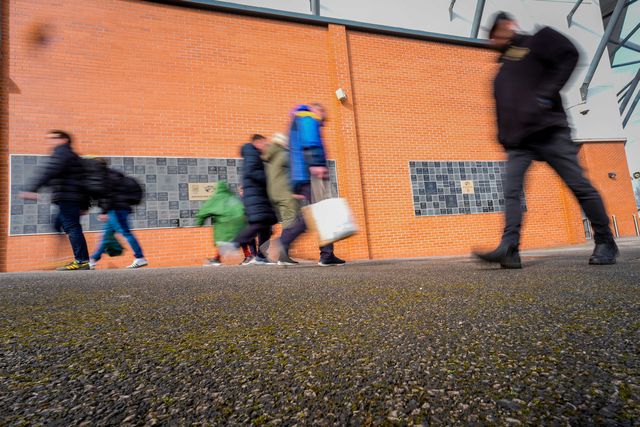 A general view shows fans walking past  the ‘our blue and amber’ memorial wall a the stadium during the Betfred Super League round 1 match Leeds Rhinos vs Warrington Wolves at AMT Headingley Stadium, Leeds, United Kingdom on 29 March 2026

(Photo by Maynard Manyowa/News Images)