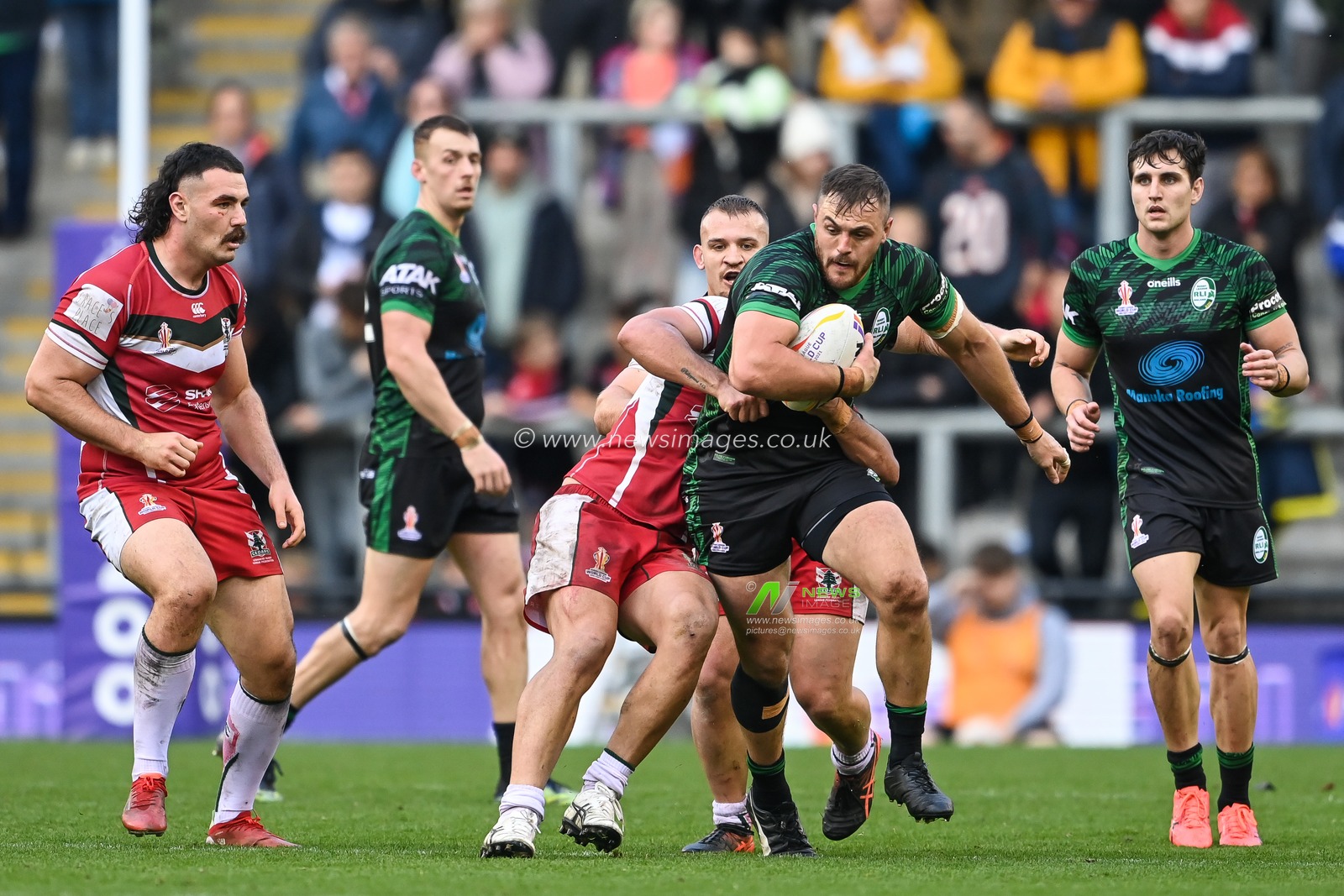 Jaimin Jolliffe of Ireland breaks the tackle of Mitchell Moses of Lebanon during the Rugby League World Cup 2021 match Ireland vs Lebanon at Leigh Sports Village, Leigh, United Kingdom, 23rd October 2022

(Photo by Craig Thomas/News Images)