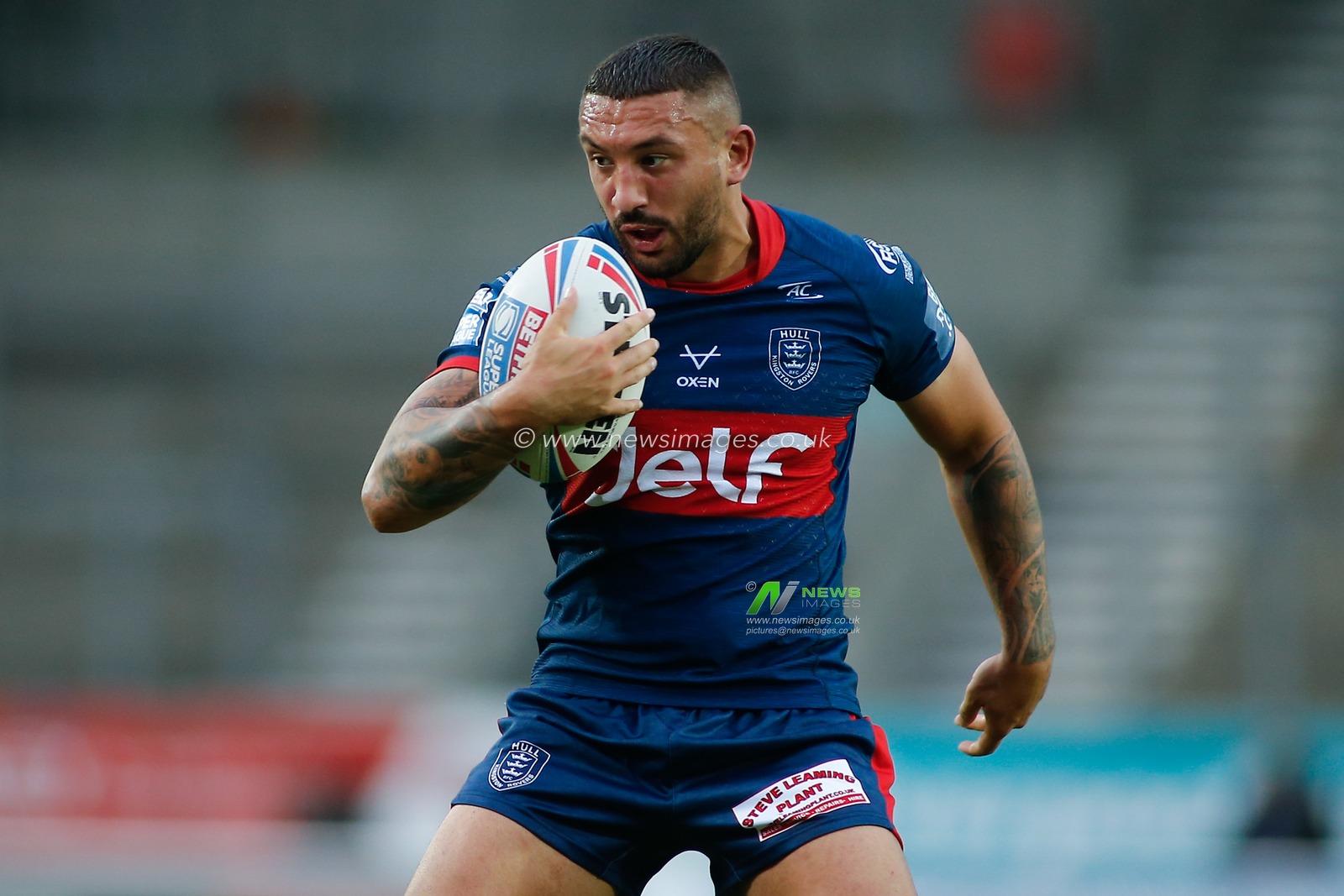 Elliot Minchella (27) of Hull KR runs with the ball.