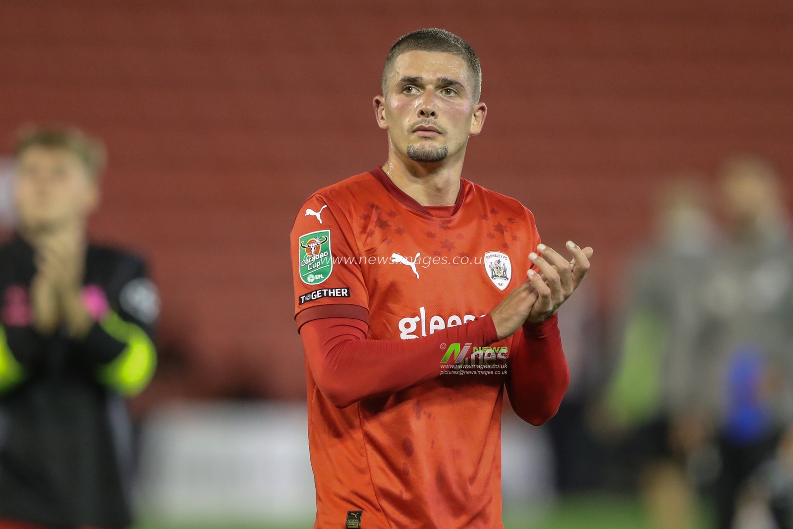 Max Watters of Barnsley applauds the home fans after the game during the Carabao Cup match Barnsley vs Sheffield United at Oakwell, Barnsley, United Kingdom, 27th August 2024

(Photo by Alfie Cosgrove/News Images)