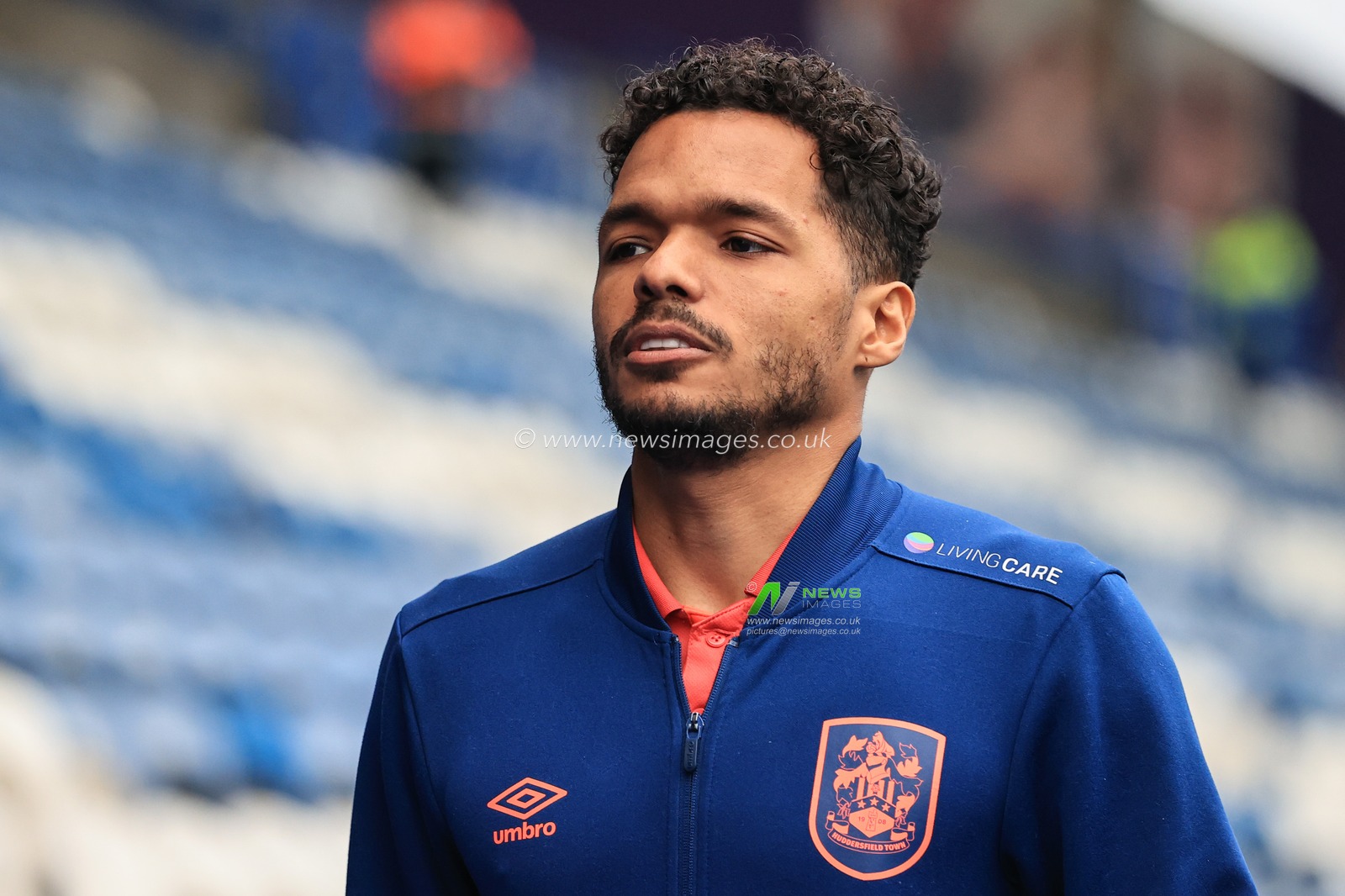 Duane Holmes #19 of Huddersfield Town arrives at the John Smiths Stadium