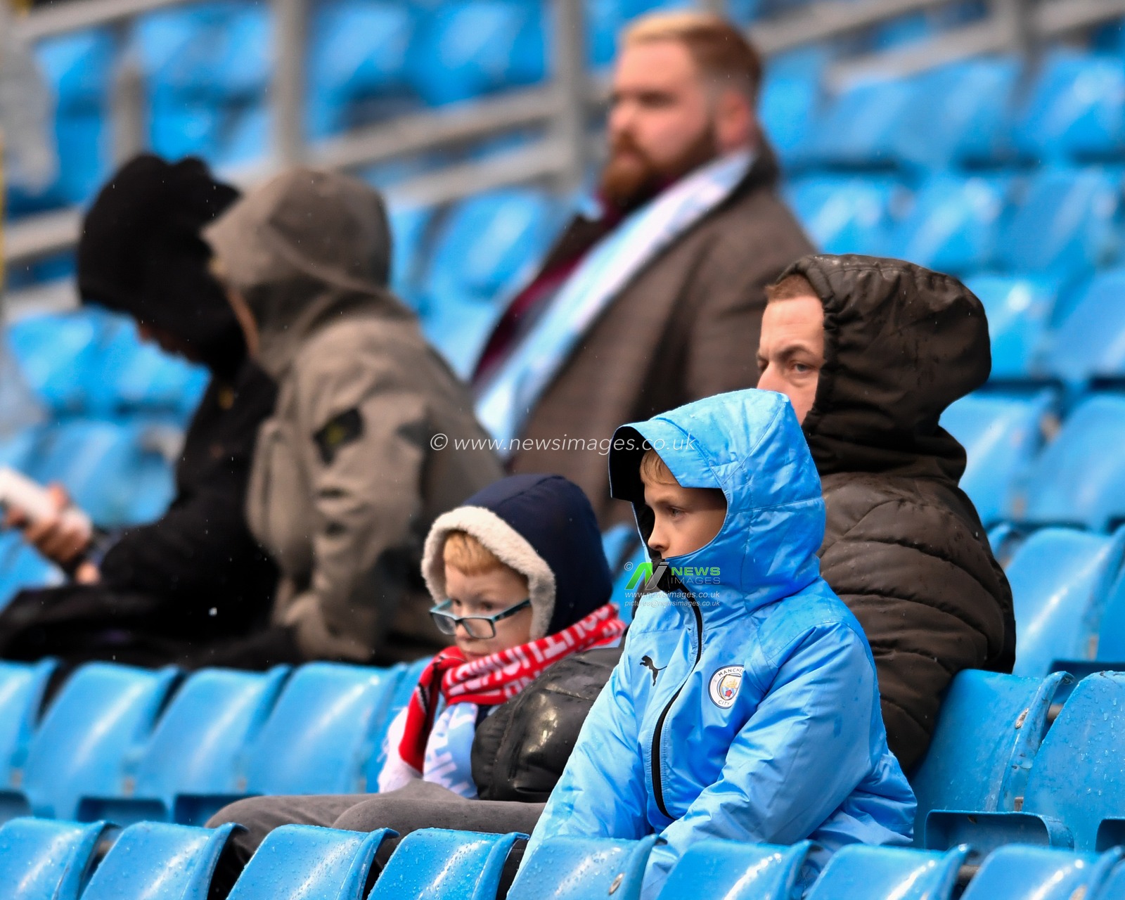 2nd November 2019, Etihad Stadium, Manchester, England; Premier League, Manchester City v Southampton : A young Manchester City fan in their waterproofs for this afternoons game at the Etihad

Credit: Simon Whitehead/News Images