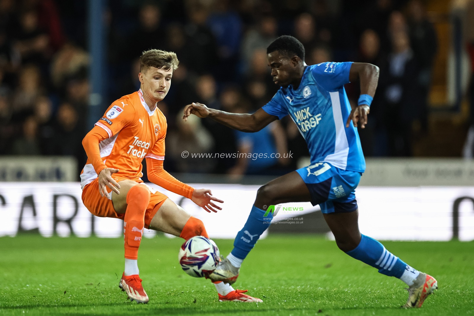 Kwame Poku of Peterborough United and Dominic Ballard of Blackpool battle for the ball during the Sky Bet League 1 match Peterborough United vs Blackpool at Weston Homes Stadium, Peterborough, United Kingdom, 22nd October 2024

(Photo by Mark Cosgrove/News Images)