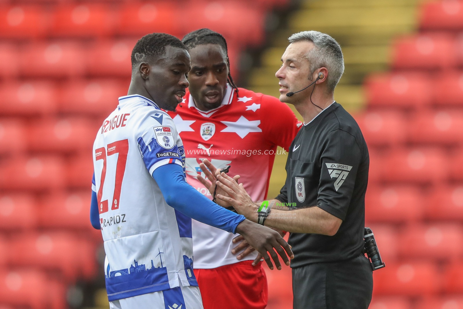 Referee Sebastian Stockbridge speaks to Amadou Mbengue of Reading and Devante Cole of Barnsley during the Sky Bet League 1 match Barnsley vs Reading at Oakwell, Barnsley, United Kingdom, 13th April 2024

(Photo by Alfie Cosgrove/News Images)
