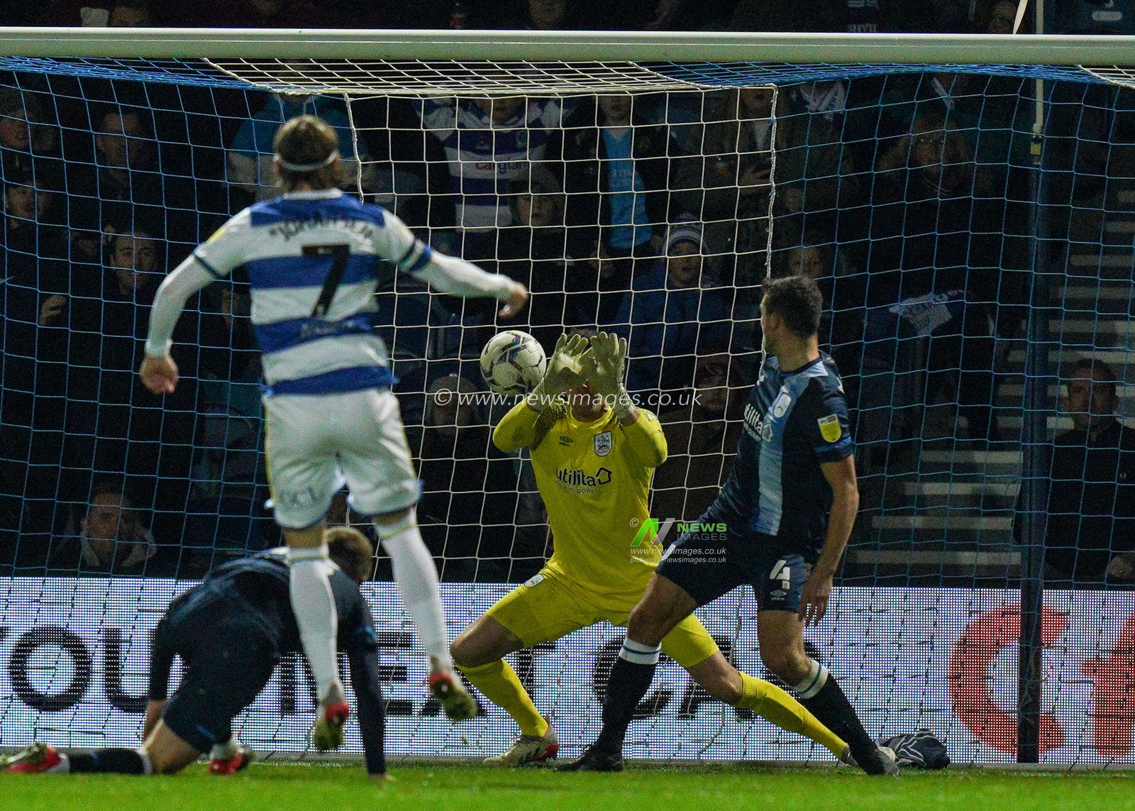 Lee Nicholls #21 of Huddersfield Town makes a great save to deny Queens Park Rangers scoring