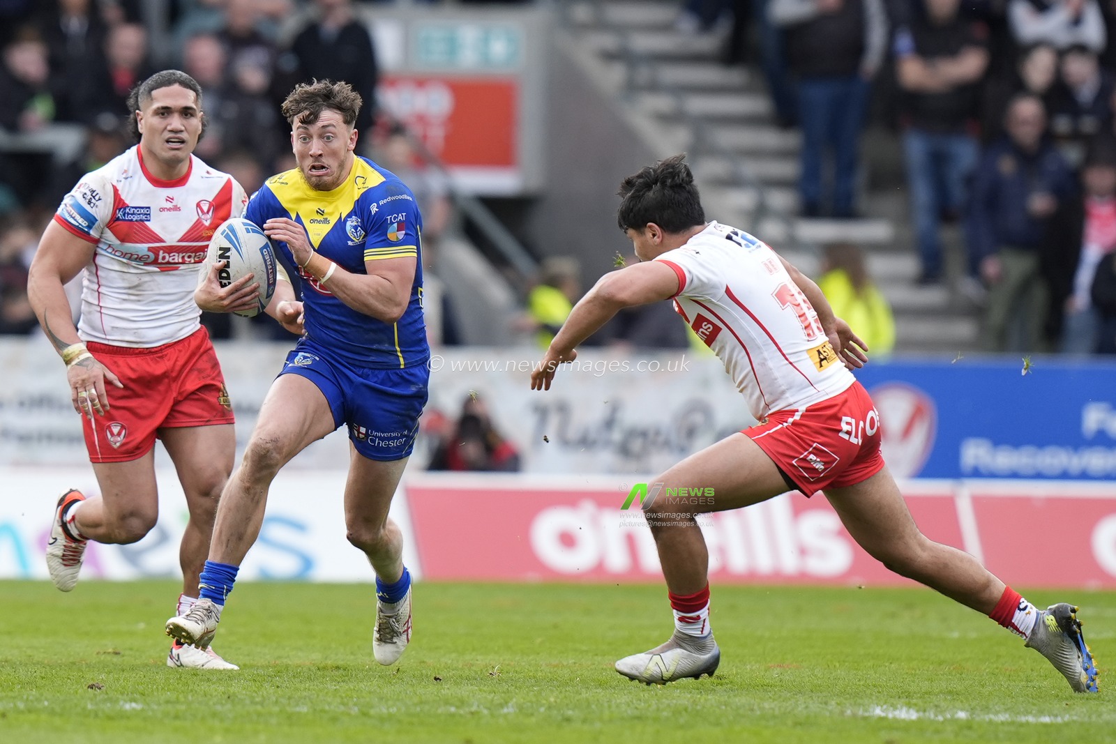 Matty Ashton of Warrington Wolves runs at James Bell of St. Helens during the Betfred Challenge Cup Quarter Final match St Helens vs Warrington Wolves at Totally Wicked Stadium, St Helens, United Kingdom, 14th April 2024

(Photo by Steve Flynn/News Images)