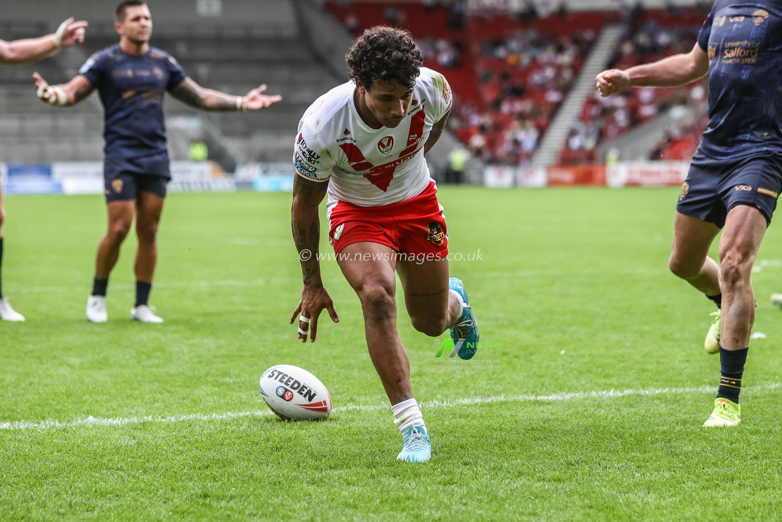 Tristan Sailor of St. Helens goes over for a try during the Betfred Super League round 16 match St Helens vs Salford Red Devils at Totally Wicked Stadium, St Helens, United Kingdom, 29th June 2025

(Photo by Alfie Cosgrove/News Images)