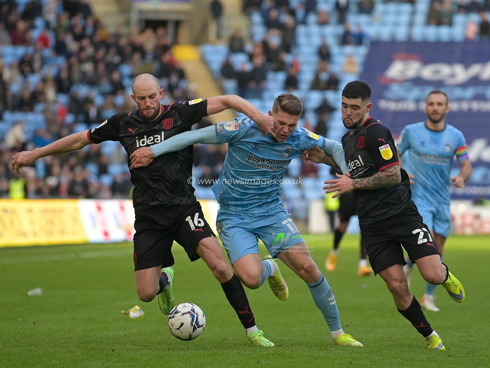 Viktor Gyokeres #17 of Coventry City battles with Matthew Clarke #16 of West Bromwich Albion and Alex Mowatt #27 of West Bromwich Albion