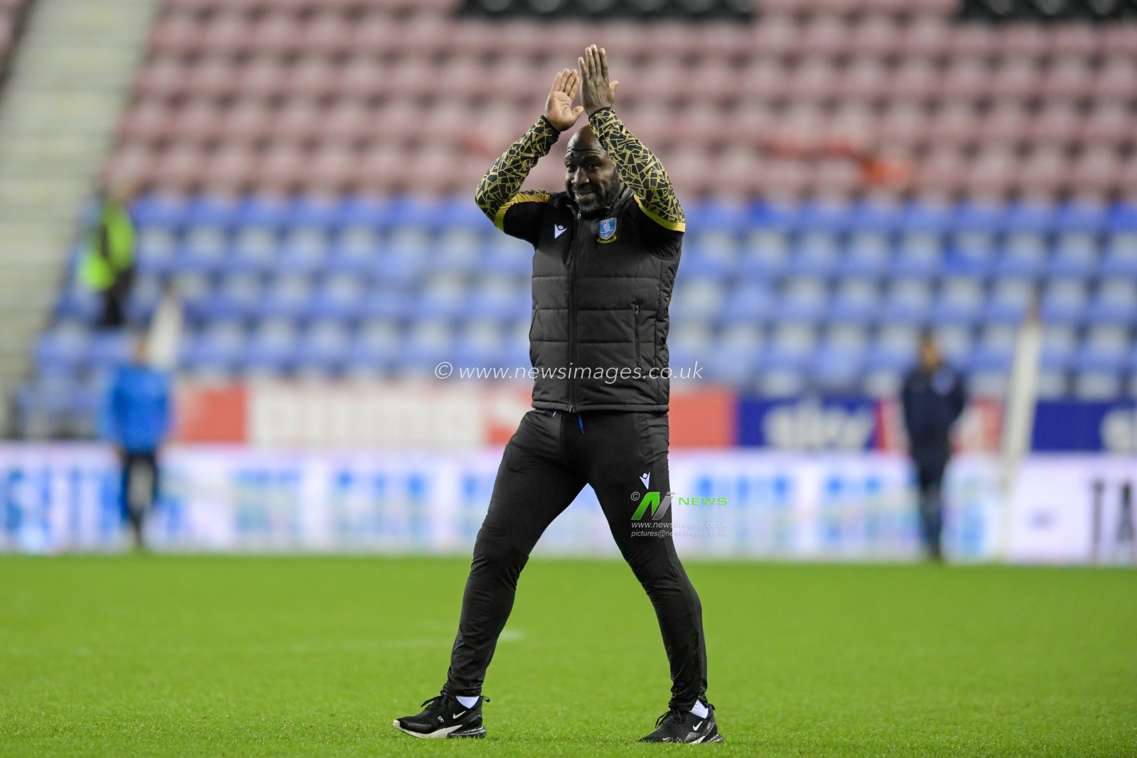 Darren Moore manager of Sheffield Wednesday celebrates in front of the travelling supporters after seeing his side beat Wigan Athletic 1-2