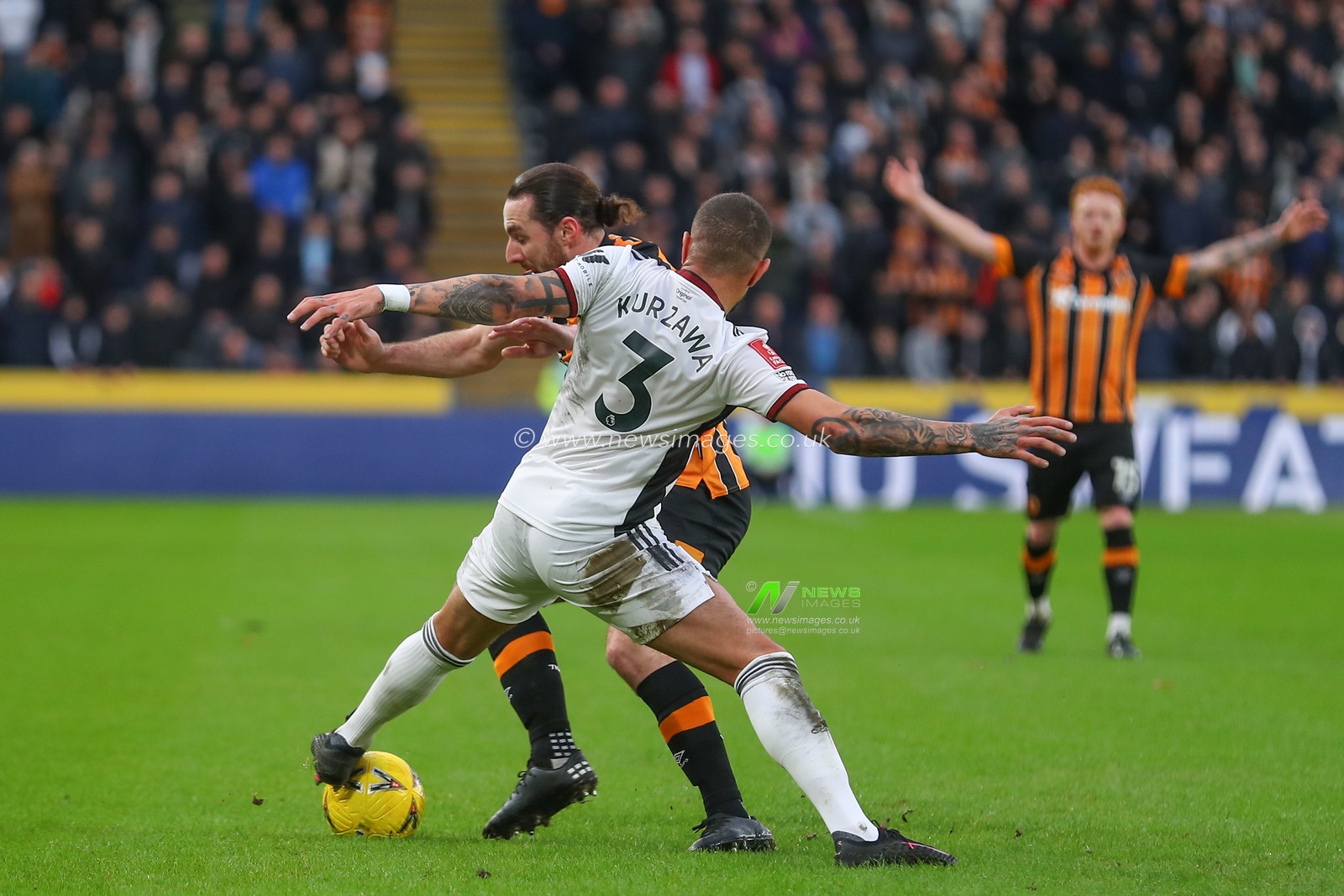 Layvin Kurzawa #3 of Fulham tackles Lewis Coyle #2 of Hull City during the Emirates FA Cup Third Round match Hull City vs Fulham at MKM Stadium, Hull, United Kingdom, 7th January 2023

(Photo by Gareth Evans/News Images)