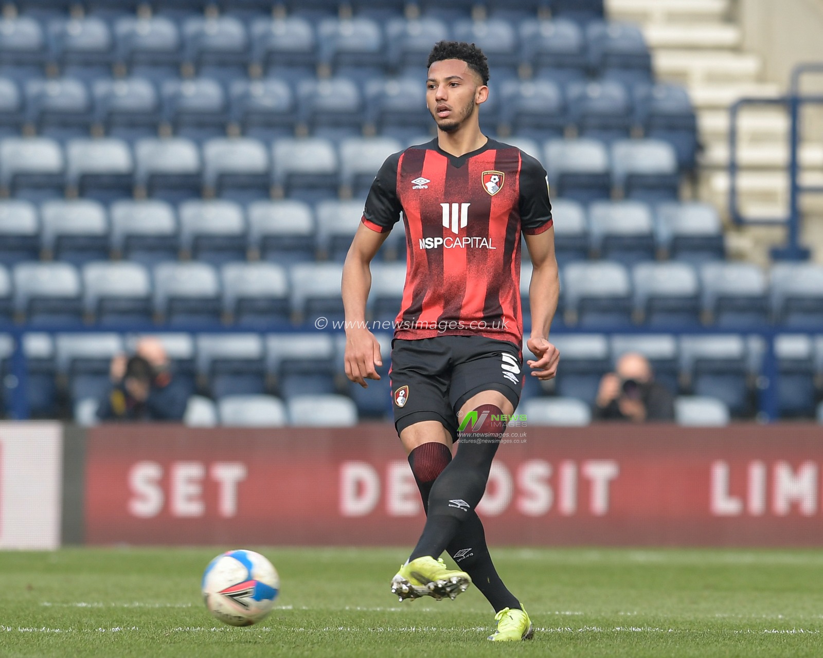 Lloyd Kelly #5 of Bournemouth passes the ball