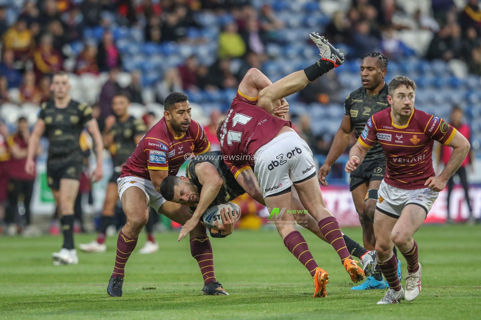 Dan Norman of Leigh Leopards is tackled by Jack Murchie of Huddersfield Giants during the Betfred Super League Round 12 match Huddersfield Giants vs Leigh Leopards at John Smith's Stadium, Huddersfield, United Kingdom, 24th May 2024

(Photo by Alfie Cosgrove/News Images)