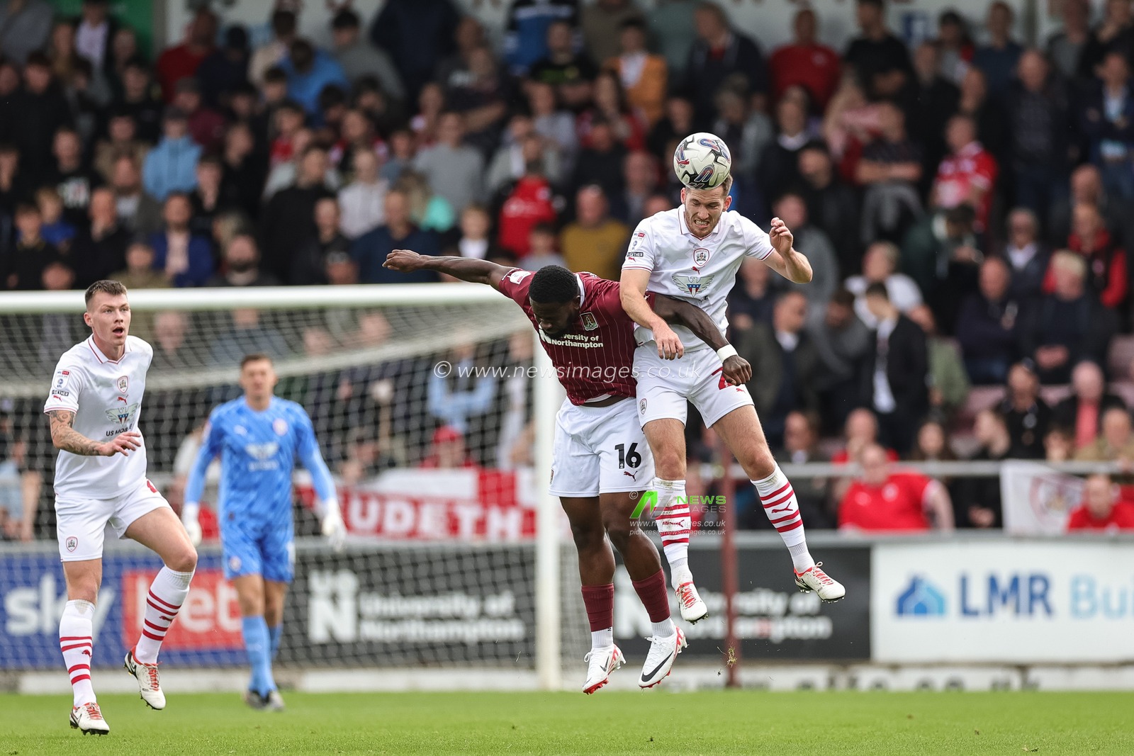 Jamie McCart #26 of Barnsley jumps up to win the high ball from Tyreece Simpson #16 of Northampton Town during the Sky Bet League 1 match Northampton Town vs Barnsley at Sixfields Stadium, Northampton, United Kingdom, 23rd September 2023

(Photo by Mark Cosgrove/News Images)