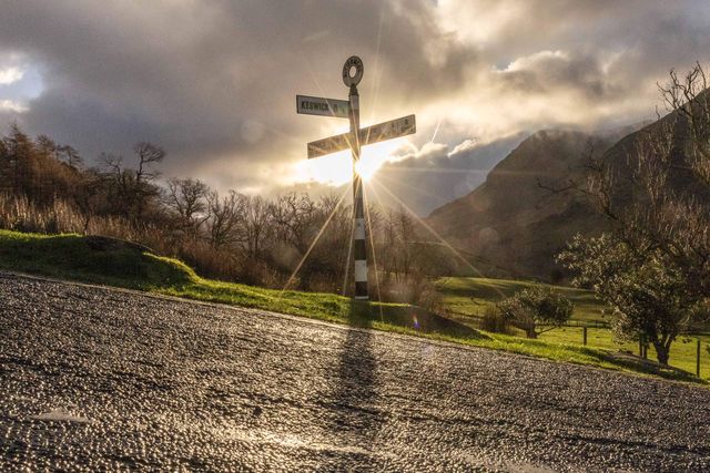 The sun shines through a road sign at Buttermere during a cold winters morning at Buttermere, TheLake District, Cumbria, United Kingdom, 3rd January 2025

(Photo by Mark Cosgrove/News Images)