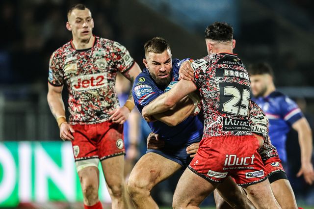 Mike McMeeken of Wakefield Trinity is tackled by Louis Brogan of Leigh Leopards during the Betfred Super League round 5 match Wakefield Trinity vs Leigh Leopards at DIY Kitchens Stadium, Wakefield, United Kingdom on 20 March 2026

(Photo by Alfie Cosgrove/News Images)