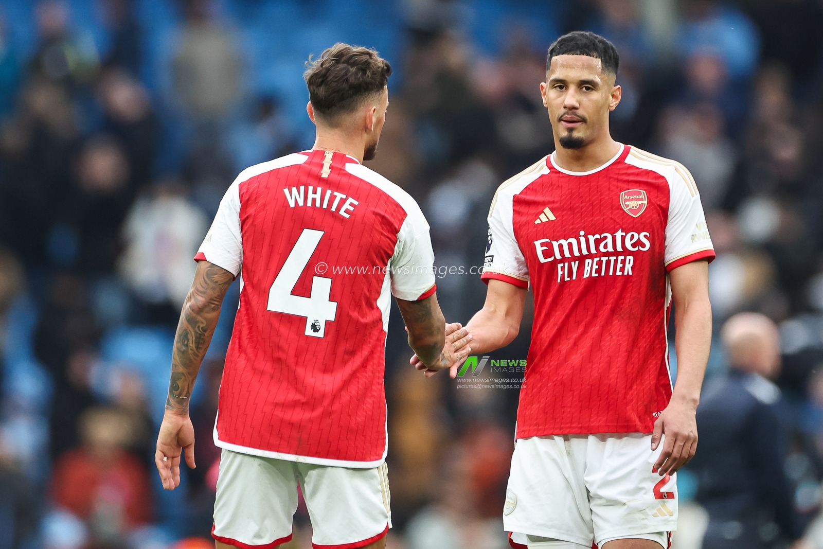 Ben White of Arsenal and William Saliba of Arsenal shake hands at end of the  the Premier League match Manchester City vs Arsenal at Etihad Stadium, Manchester, United Kingdom, 31st March 2024

(Photo by Mark Cosgrove/News Images)