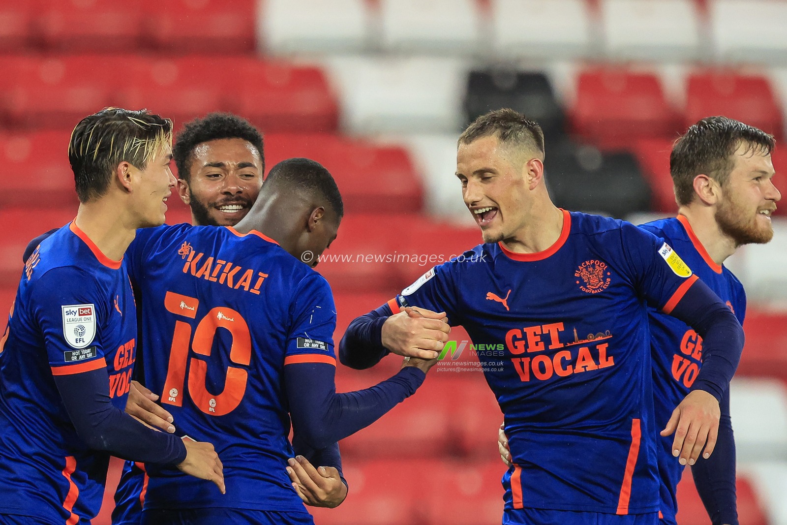 Sullay Kaikai #10 of Blackpool celebrates his goal with his teammates to make it 0-1