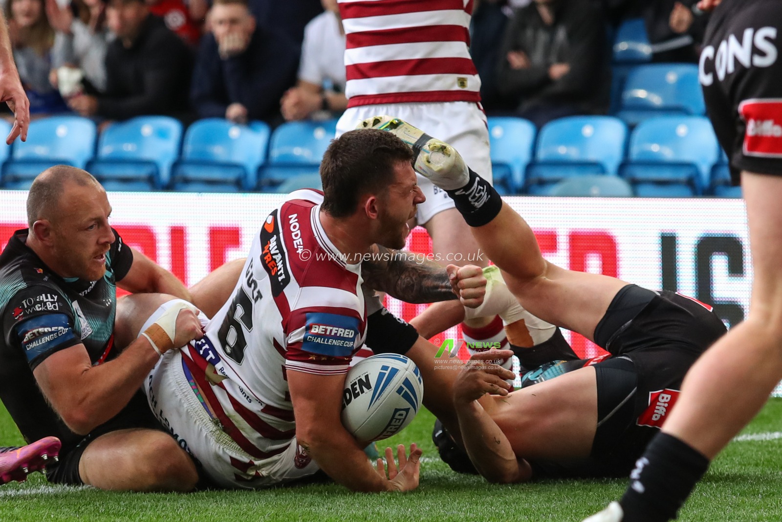 Cade Cust  #6 of Wigan Warriors goes over for a try