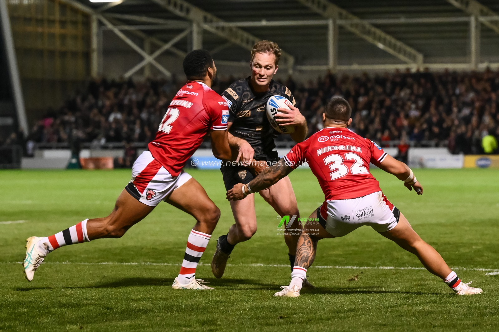 Matt Moylan of Leigh Leopards is tackled by Kallum Watkins of Salford Red Devils during the Betfred Super League play-off Eliminator 1 Salford Red Devils v Leigh Leopards at Salford Community Stadium, Eccles, United Kingdom, 27th September 2024

(Photo by Craig Thomas/News Images)