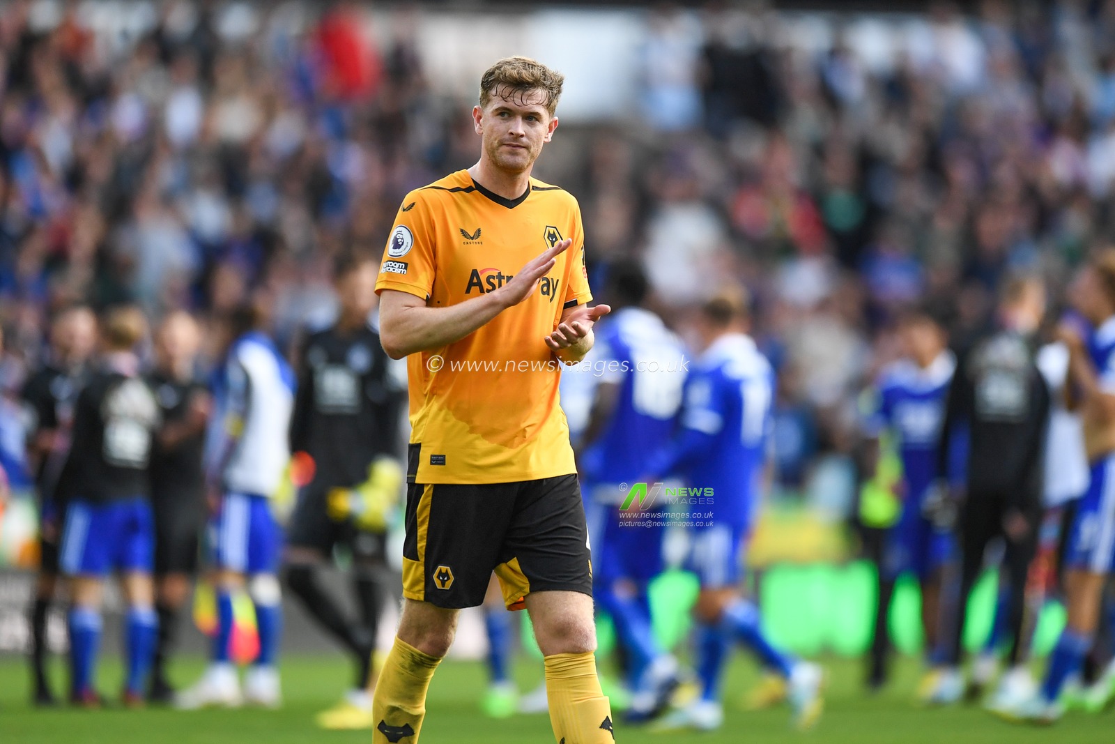 Nathan Collins #4 of Wolverhampton Wanderers applauds the home supporters while Leicester city celebrate  during the Premier League match Wolverhampton Wanderers vs Leicester City at Molineux, Wolverhampton, United Kingdom, 23rd October 2022

(Photo by Mike Jones/News Images)