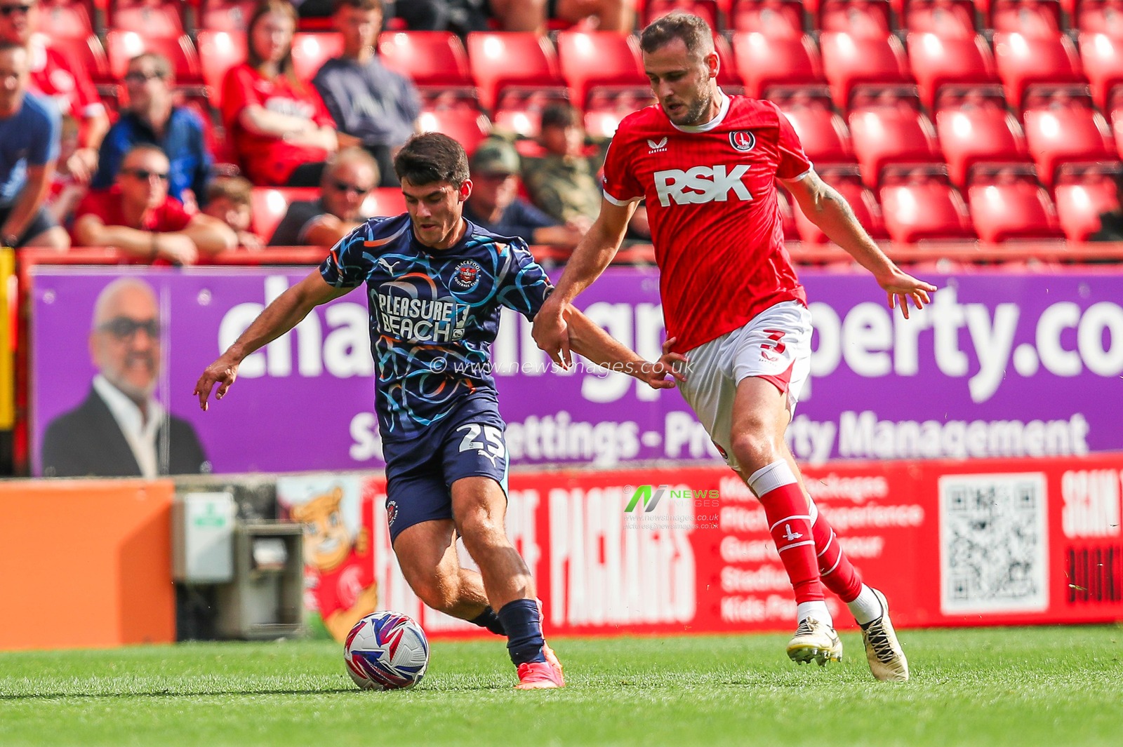 Rob Apter of Blackpool is put under pressure by Macaulay Gillesphey of Charlton Athletic during the Sky Bet League 1 match Charlton Athletic vs Blackpool at The Valley, London, United Kingdom, 21st September 2024

(Photo by Izzy Poles/News Images)