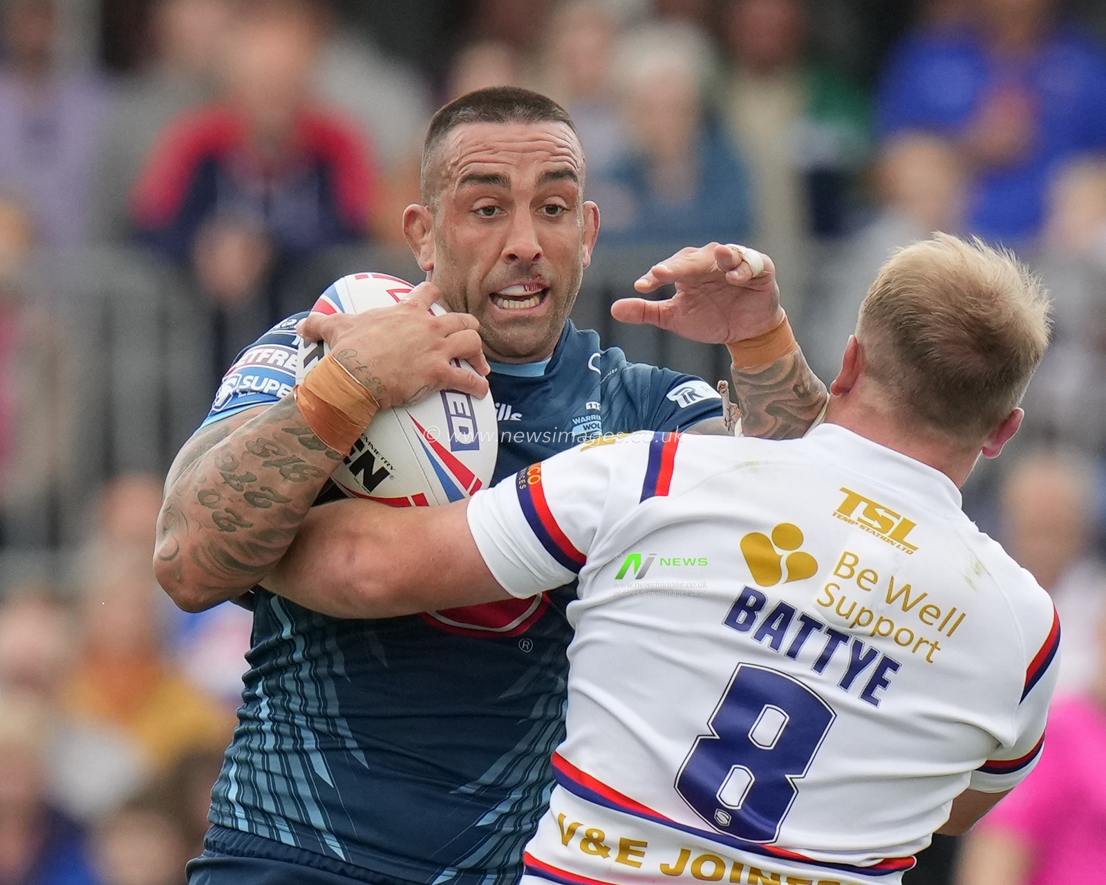 Paul Vaughan #10 of Warrington Wolves runs into Eddie Battye #8 of Wakefield Trinity during the Betfred Super League Round 20 match Wakefield Trinity vs Warrington Wolves at The Be Well Support Stadium, Wakefield, United Kingdom, 30th July 2023

(Photo by Steve Flynn/News Images)