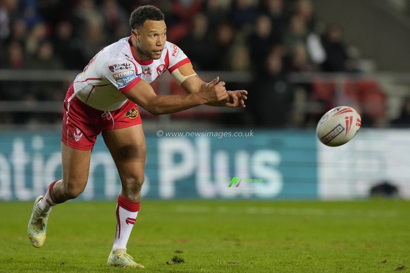 Moses Mbye of St. Helens passes the ball during the Betfred Super League  Round 8 match St Helens vs Hull FC at Totally Wicked Stadium, St Helens, United Kingdom, 19th April 2024

(Photo by Steve Flynn/News Images)