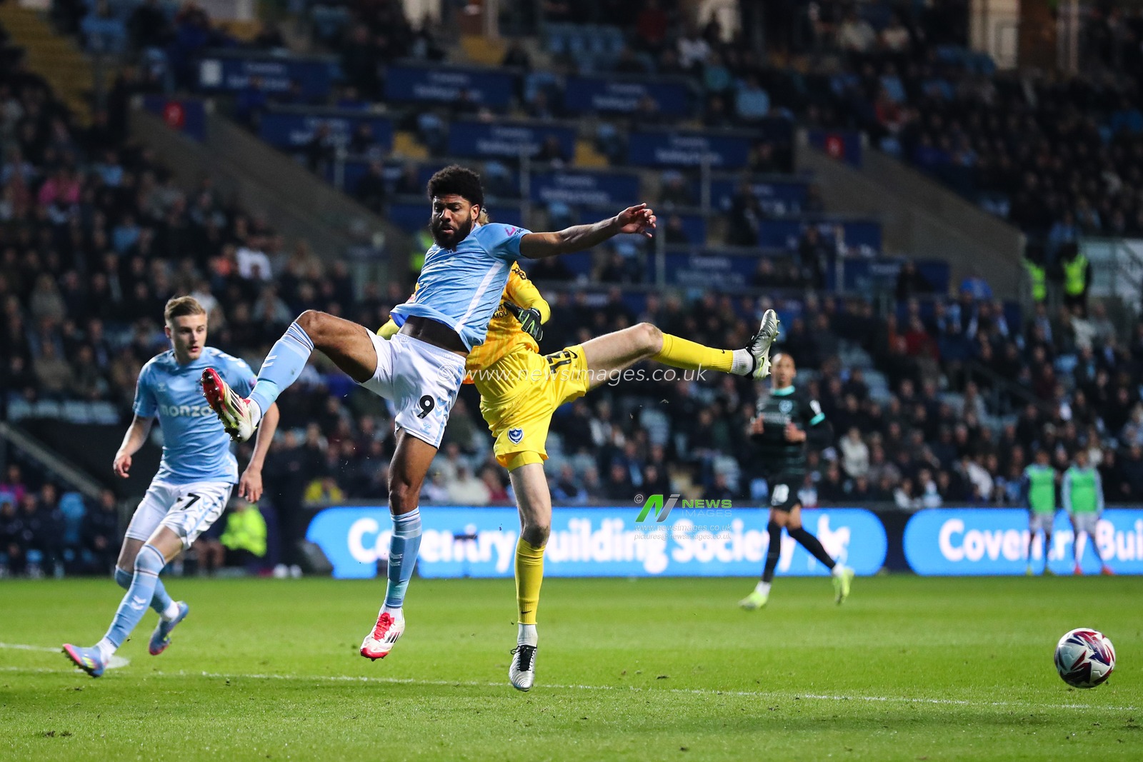 Nicolas Schmid of Portsmouth and Ellis Simms of Coventry City battle for the ball during the Sky Bet Championship match Coventry City vs Portsmouth at Coventry Building Society Arena, Coventry, United Kingdom, 9th April 2025

(Photo by Gareth Evans/News Images)