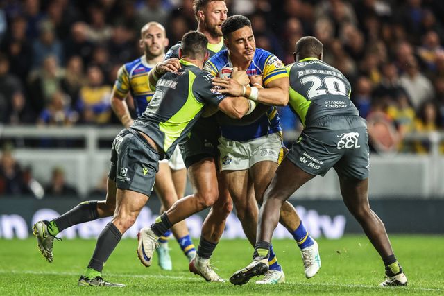 Keenan Palasia of Leeds Rhinos is tackled by Benjamin Garcia of Catalan Dragons and Jordan Dezaria of Catalan Dragons during the Betfred Super League round 26 match Leeds Rhinos vs Catalans Dragons at Headingley Stadium, Leeds, United Kingdom, 11th September 2025

(Photo by Alfie Cosgrove/News Images)