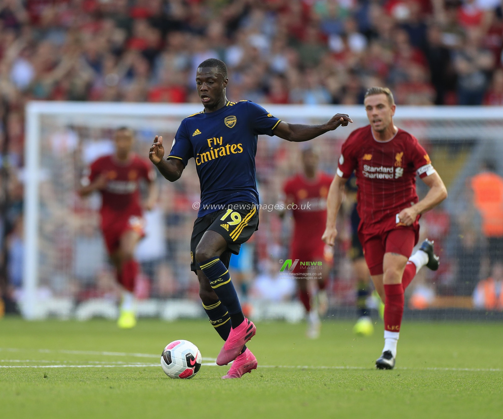 23rd August 2019 , Anfield, Liverpool, England; Premier League Football, Liverpool vs Arsenal ;   Nicolas Pepe (19) of Arsenal runs clear on goal

Credit: Conor Molloy/News Images 


Premier League/EFL Football images are subject to DataCo Licence