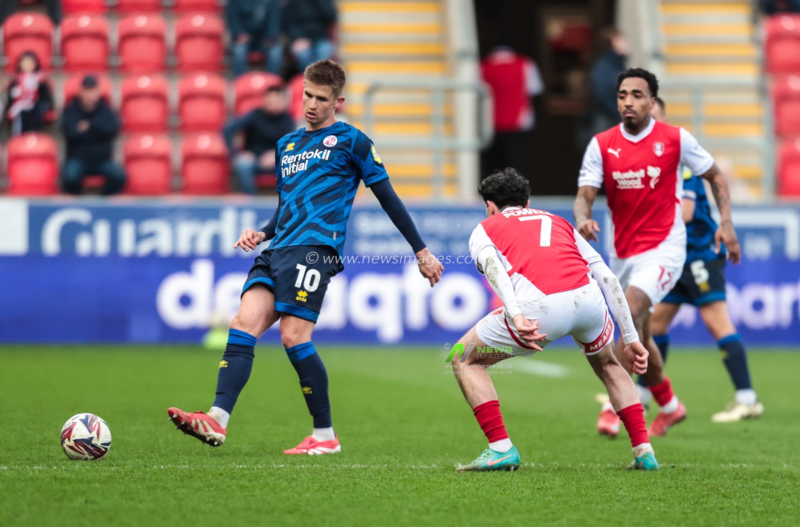 Liam Fraser of Crawley Town passes the ball despite pressure from Joe Powell of Rotherham United during the Sky Bet League 1 match Rotherham United vs Crawley Town at New York Stadium, Rotherham, United Kingdom, 29th March 2025

(Photo by Richard Bierton/News Images)