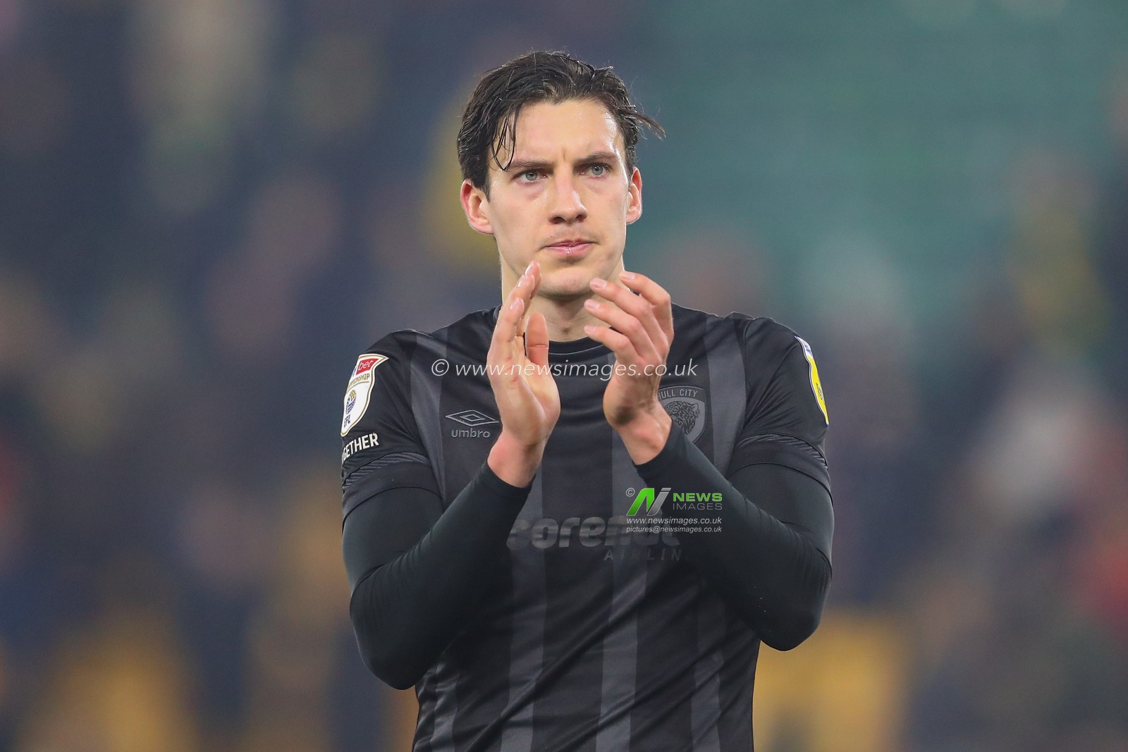 Alfie Jones #5 of Hull City applauds the travelling fans after the Sky Bet Championship match Norwich City vs Hull City at Carrow Road, Norwich, United Kingdom, 14th February 2023

(Photo by Gareth Evans/News Images)