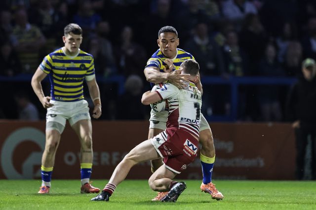 Jai Field of Wigan Warriors is tackled by Albert Hopoate of Warrington Wolves during the Betfred Super League round 9 match Warrington Wolves vs Wigan Warriors at The Halliwell Jones Stadium, Warrington, United Kingdom on 24 April 2026

(Photo by Mark Cosgrove/News Images)