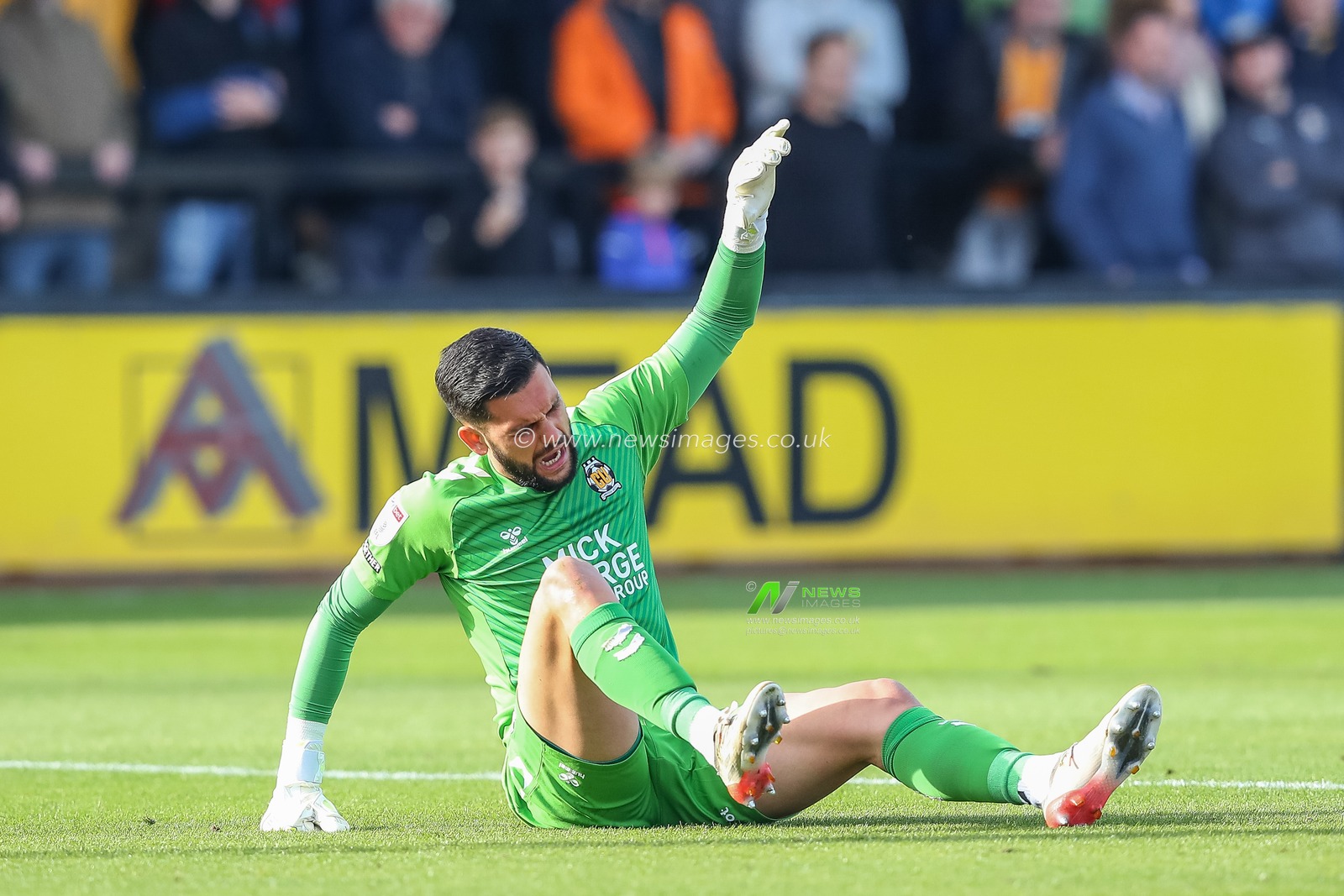 Dimitar Mitov #1 of Cambridge United goes down injured after a challenge from Michael Smith #24 of Sheffield Wednesday during the Sky Bet League 1 match Cambridge United vs Sheffield Wednesday at Abbey Stadium, Cambridge, United Kingdom, 15th October 2022

(Photo by Gareth Evans/News Images)