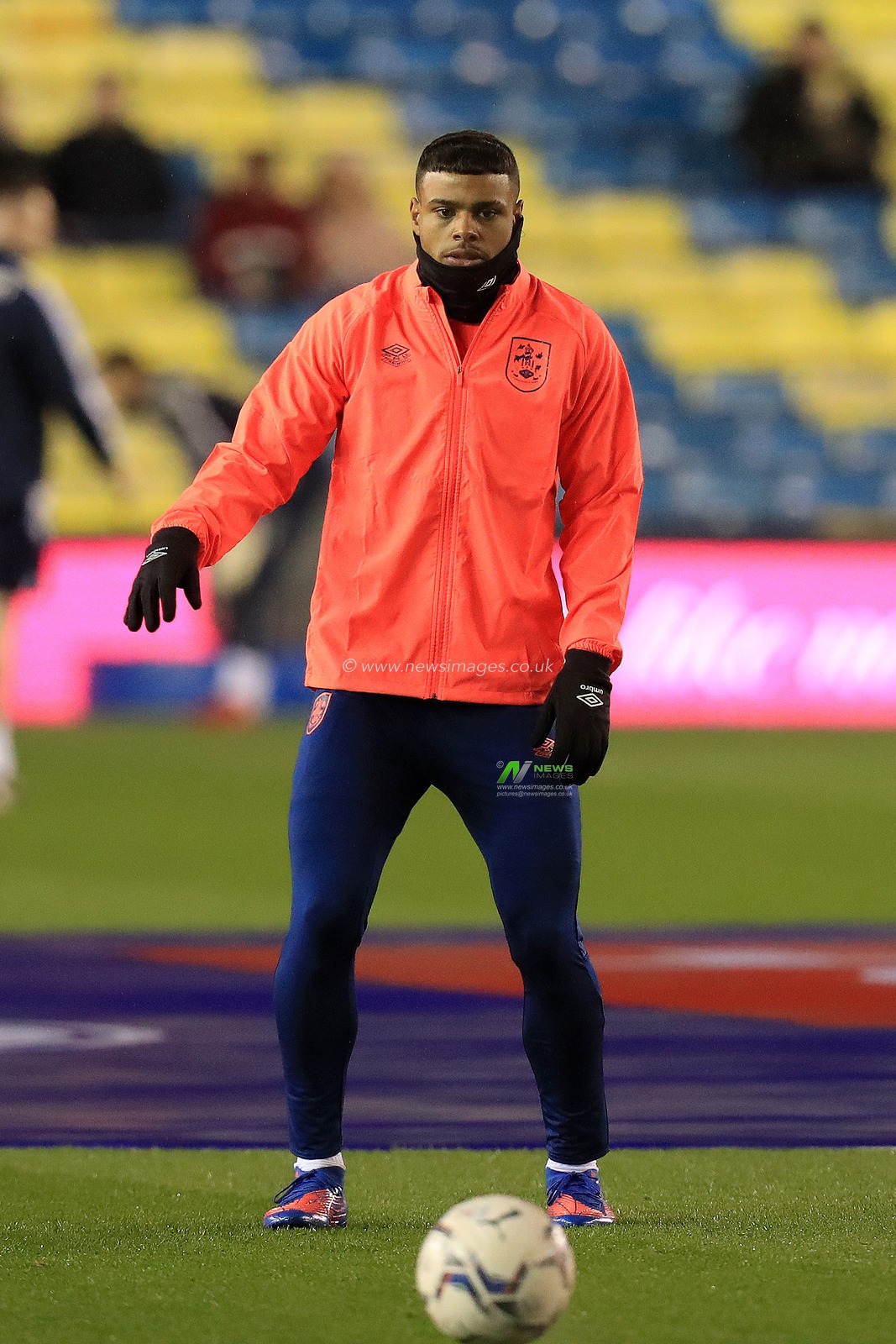 Tino Anjorin #7 of Huddersfield Town warming up.