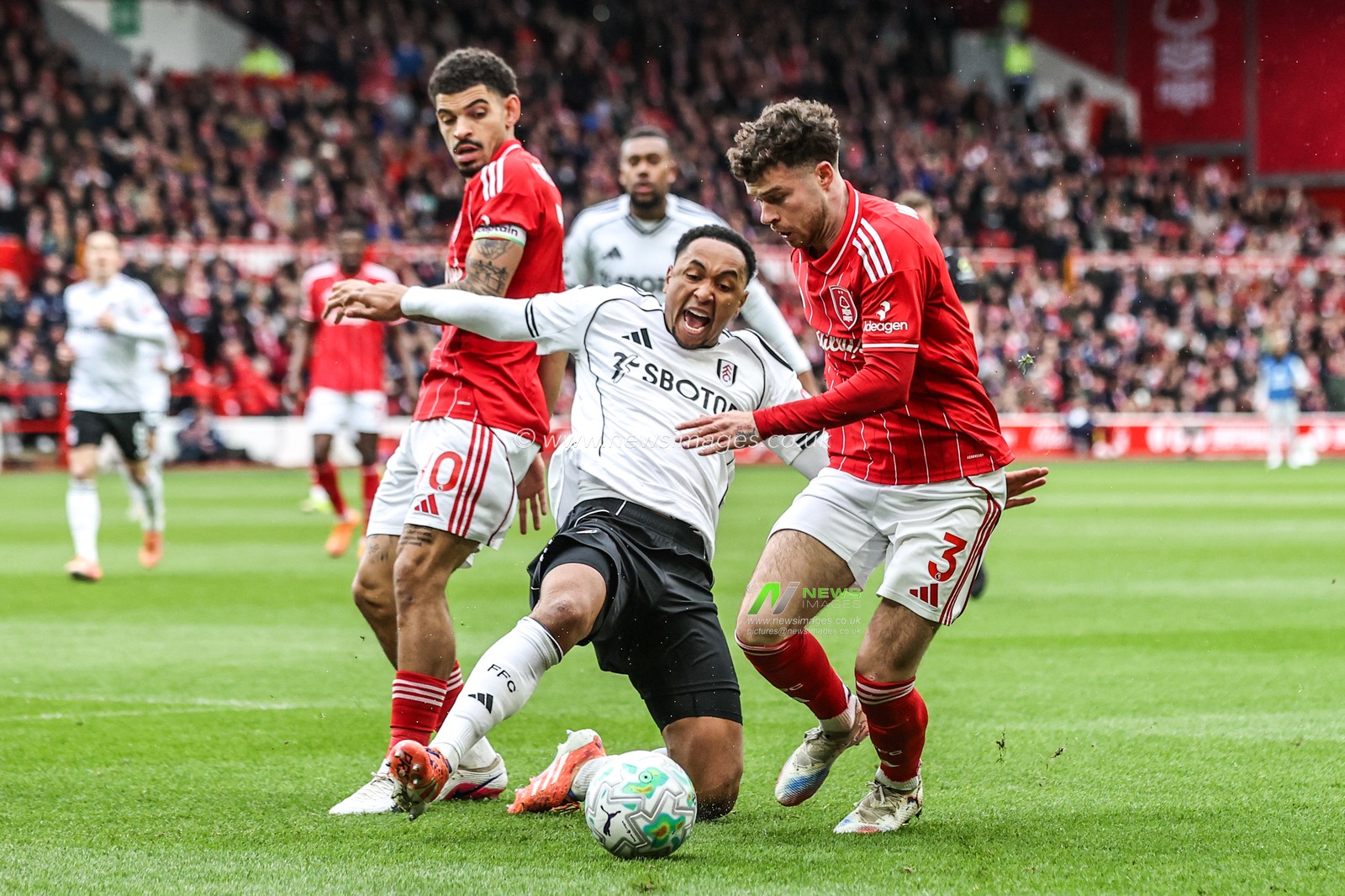 Kenny Tete of Fulham goes in for the tackle on Neco Williams of Nottingham Forest during the Premier League match Nottingham Forest vs Fulham at City Ground, Nottingham, United Kingdom on 15 March 2026

(Photo by Alfie Cosgrove/News Images)