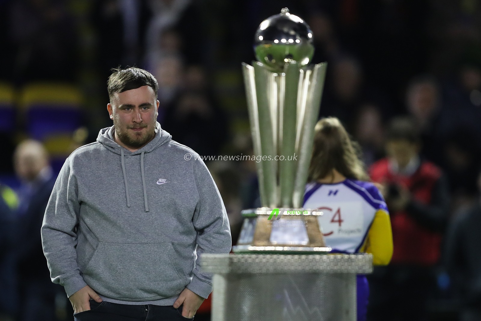 Luke Littler looks at the PDC trophy during the Betfred Super League Round 2 match Warrington Wolves vs Catalans Dragons at Luke Littler Stadium, Warrington, United Kingdom, 21st February 2025

(Photo by Gareth Evans/News Images)