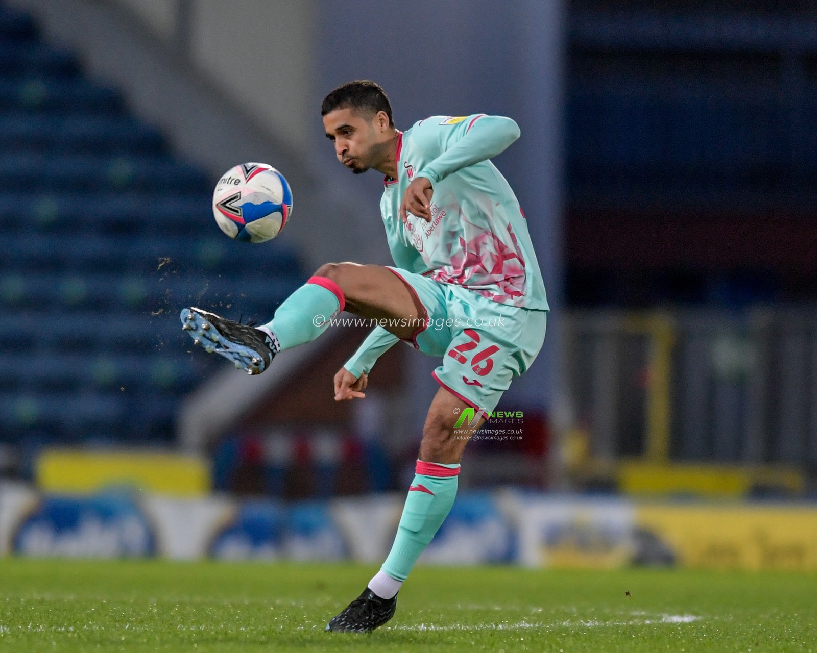 Kyle Naughton #26 of Swansea City clears the ball