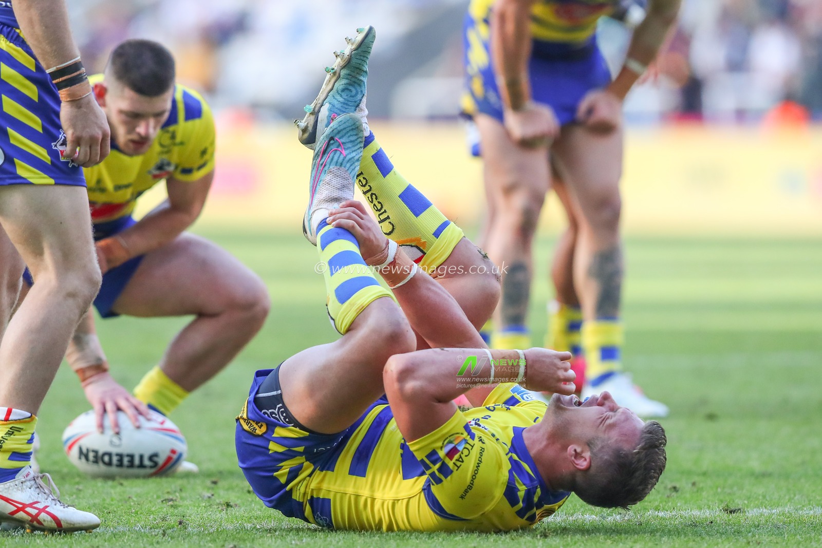 Josh Drinkwater #7 of Warrington Wolves goes down injured during the Magic Weekend match Hull FC vs Warrington Wolves at St. James's Park, Newcastle, United Kingdom, 4th June 2023

(Photo by Gareth Evans/News Images)