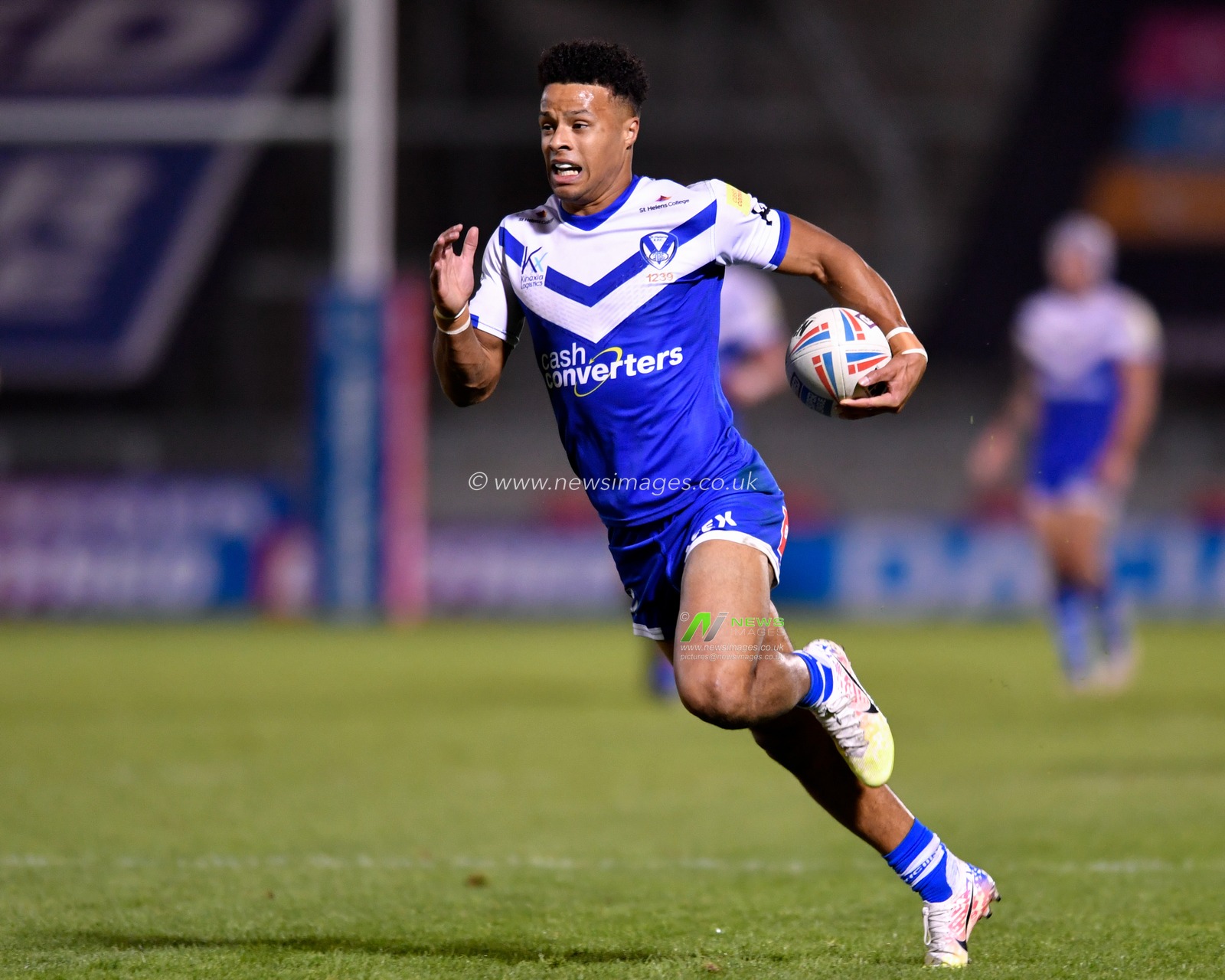 Regan Grace (5) of St Helens runs at full speed towards the try line