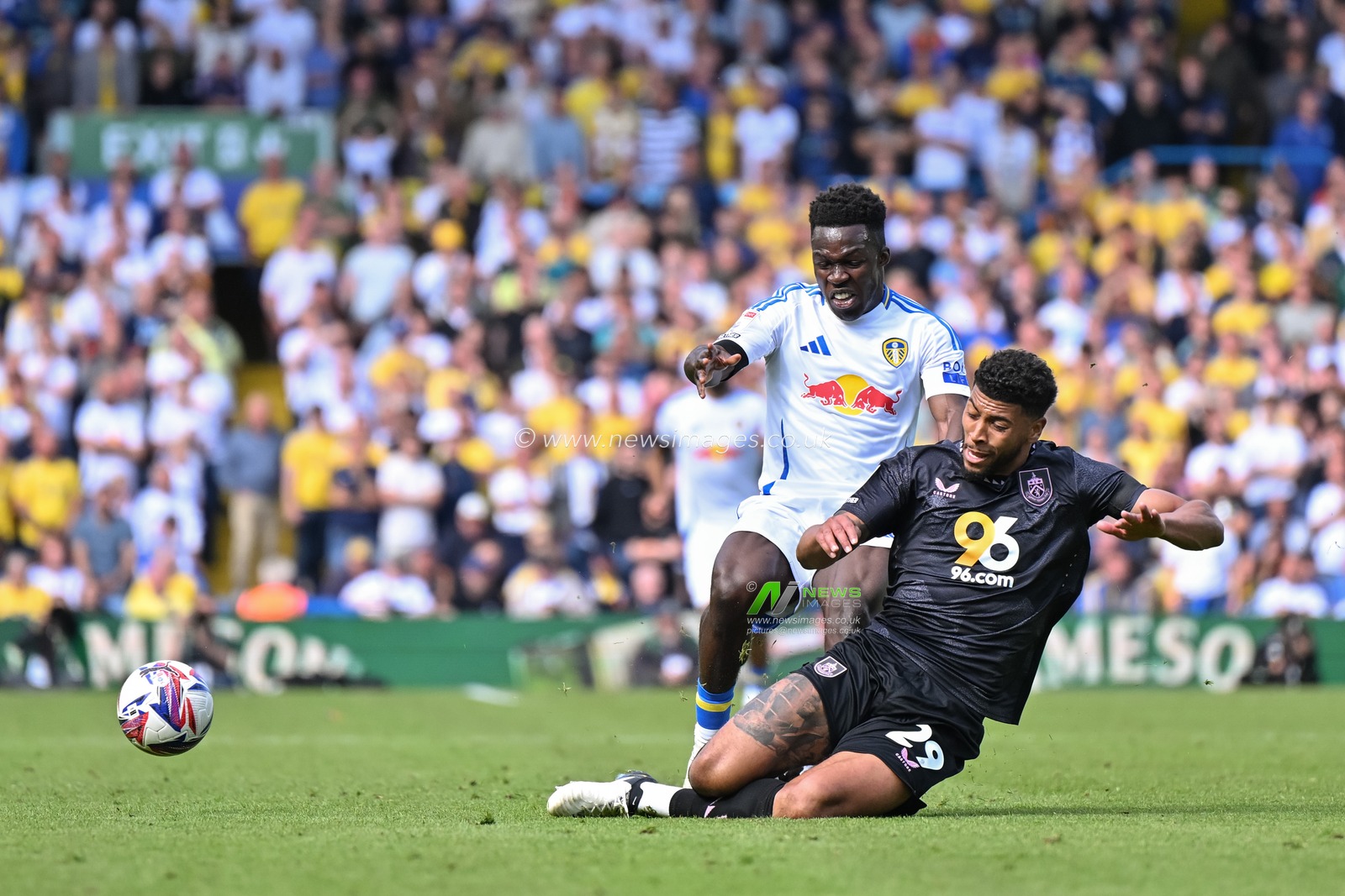 Josh Laurent of Burnley tackled Wilfried Gnonto of Leeds United during the Sky Bet Championship match Leeds United vs Burnley at Elland Road, Leeds, United Kingdom, 14th September 2024

(Photo by Cody Froggatt/News Images)