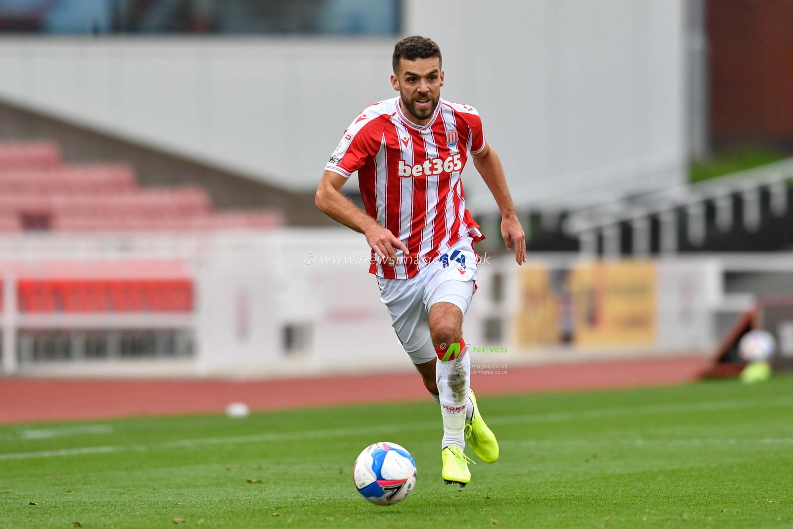 Tommy Smith (14) of Stoke City runs forward with the ball