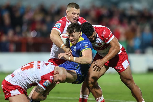 Matty Ashton of Warrington Wolves is tackled by Dean Hadley of Hull KR during the Betfred Super League Semi-Finals match Hull KR vs Warrington Wolves at Sewell Group Craven Park, Kingston upon Hull, United Kingdom, 4th October 2024

(Photo by Alfie Cosgrove/News Images)